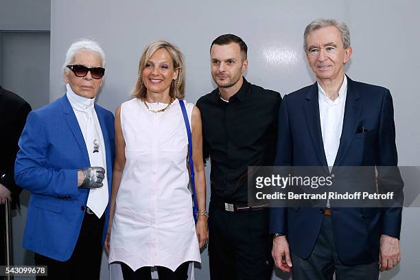 Karl Lagerfeld, Helene Arnault, Fashion designer Kris Van Assche and Owner of LVMH Luxury Group Bernard Arnault pose Backstage after the Dior Homme...