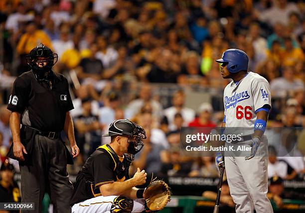 Yasiel Puig of the Los Angeles Dodgers argues a strike with home plate umpire Ron Kulpa in the seventh inning during the game against the Pittsburgh...