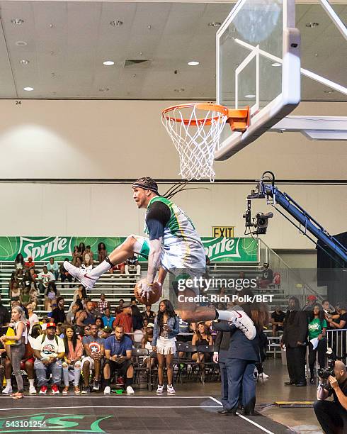 Dunk artist Kenny Dobbs participates in the slam dunk contest during the 2016 BET Experience on June 25, 2016 in Los Angeles, California.