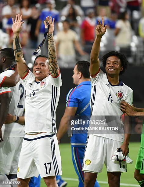 Colombia's Dayro Moreno and Juan Cuadrado wave after winning the Copa America Centenario third place football match against the USA in Glendale,...