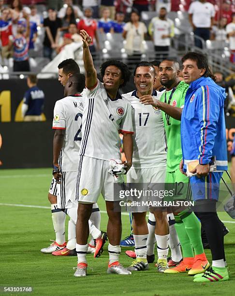 Colombia's Juan Cuadrado gestures next to teammates after winning the Copa America Centenario third place football match against the USA in Glendale,...