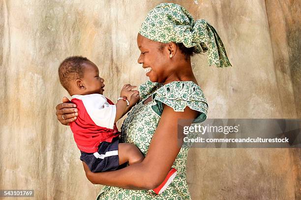 a mother laughing with her baby - commerceandculturestock stock pictures, royalty-free photos & images