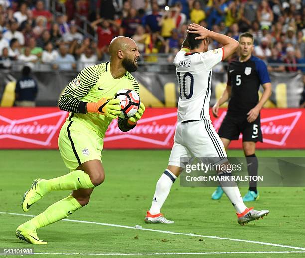 S goalkeeper Tim Howard holds the ball as Colombia's James Rodriguez gestures during the Copa America Centenario third place football match in...