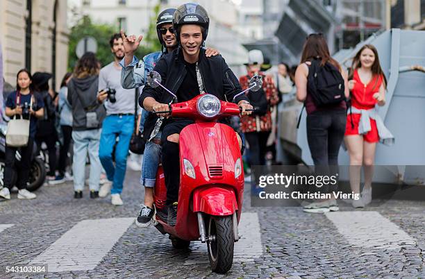 Brazilian model Francisco Lachowski "Chico" and Marlon Teixeira on a red Vespa outside Balmain during the Paris Fashion Week Menswear Spring/Summer...