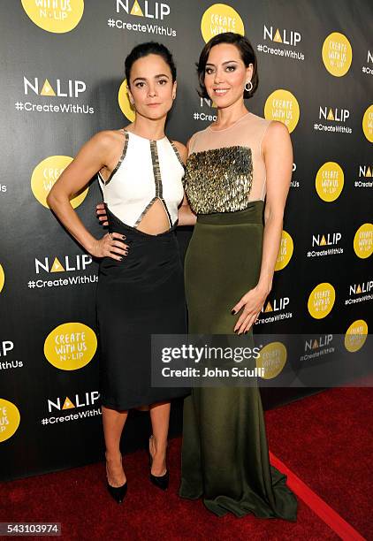 Actresses Alice Braga and Aubrey Plaza attend the NALIP 2016 Latino Media Awards at Dolby Theatre on June 25, 2016 in Hollywood, California.