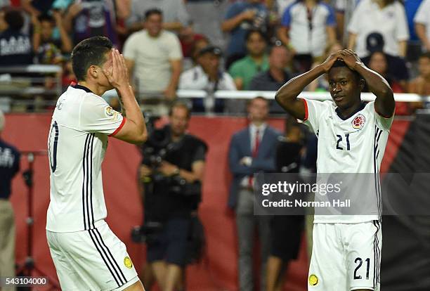 James Rodriguez and teammate Marlos Moreno of Colombia react after missing a shot during a third place match between United States and Colombia at...