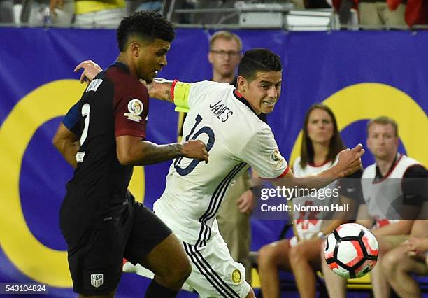 DeAndre Yedlin of the United States battles for the ball with James Rodriguez of Colombia during a third place match between United States and...