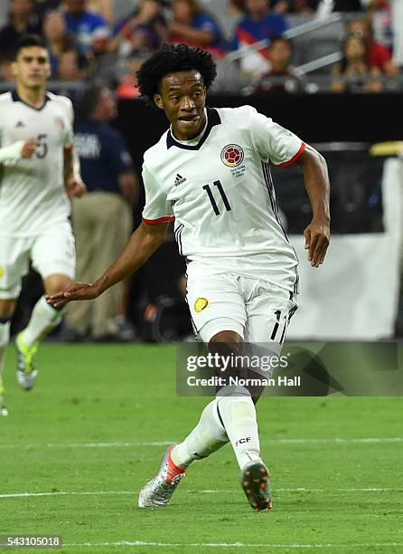 Juan Cuadrado of Colombia follows through on a kick during a third place match between United States and Colombia at University of Phoenix Stadium as...