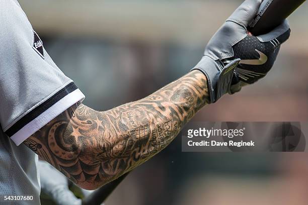Brett Lawrie of the Chicago White Sox holds a bat with his tattooed right arm in the sixth inning during a MLB game at Comerica Park on June 5, 2016...