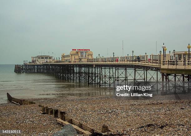 midday mists on the pier - worthing pier stock pictures, royalty-free photos & images