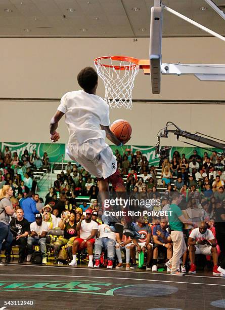 People participate in the slam dunk contest during the 2016 BET Experience on June 25, 2016 in Los Angeles, California.