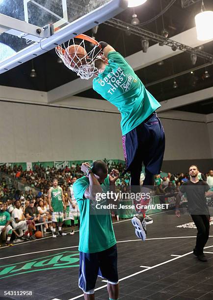 People participate in the slam dunk contest during the 2016 BET Experience on June 25, 2016 in Los Angeles, California.