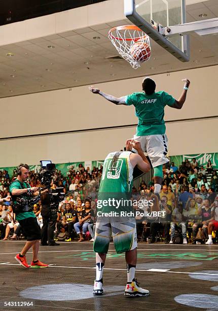 People participate in the slam dunk contest during the 2016 BET Experience on June 25, 2016 in Los Angeles, California.