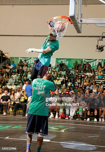 People participate in the slam dunk contest during the 2016 BET Experience on June 25, 2016 in Los Angeles, California.