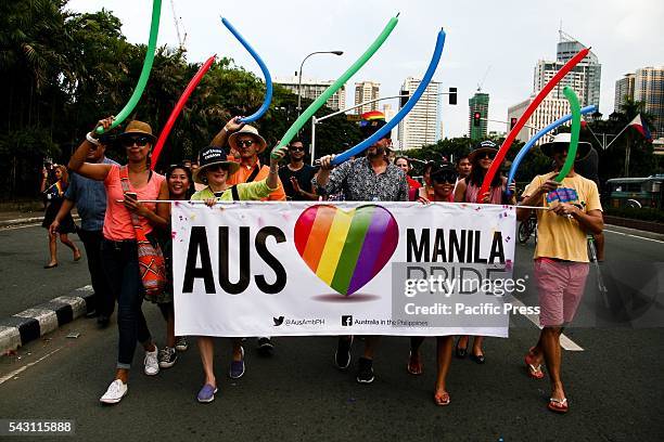 Australian embassy staff walking through downtown Manila during the Gay Pride Parade. LGBTQ community members participate in the 22nd Gay Pride March...