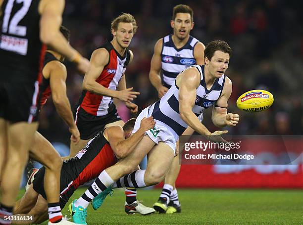 Jarryn Geary of the Saints tackles Patrick Dangerfield of the Cats during the round 14 AFL match between the St Kilda Saints and the Geelong Cats at...