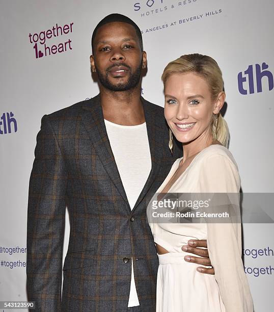 Former NFL player Kerry Rhodes and Nicky Whalen arrive at together1heart launch party hosted by AnnaLynne McCord at Sofitel Hotel on June 25, 2016 in...