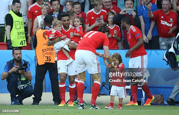 Neil Taylor of Wales with his children and Gareth Bale with his daughter Alba Bale celebrate the victory following the UEFA EURO 2016 round of 16...