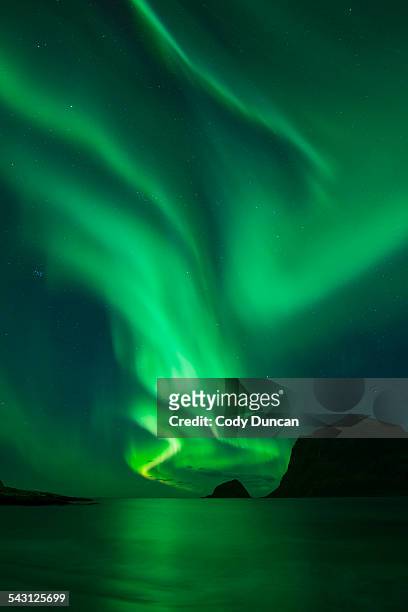 northern lights - aurora borealis shine in sky over vik beach, vestvagoy, lofoten islands, norway - aurora borealis lofoten stock-fotos und bilder