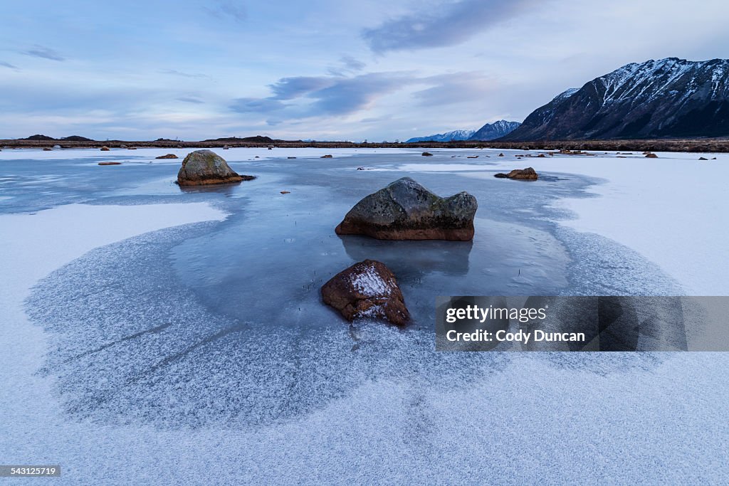 Frozen pond in winter, Gimsoy, Lofoten Islands, Norway
