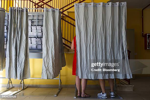 Voter marks her ballot paper in a polling booth in the Spanish general election in Madrid, Spain, on Sunday, June 26, 2016. Spaniards began voting on...