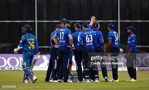 Dinesh Chandimal of Sri Lanka walks off past the celebrating England players after his dismissal during The 3rd ODI Royal London One-Day match...