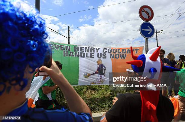 France fans take photos of Irish flag with a picture of the Thierry Henry handball before the UEFA EURO 2016 Round of 16 match between France and...