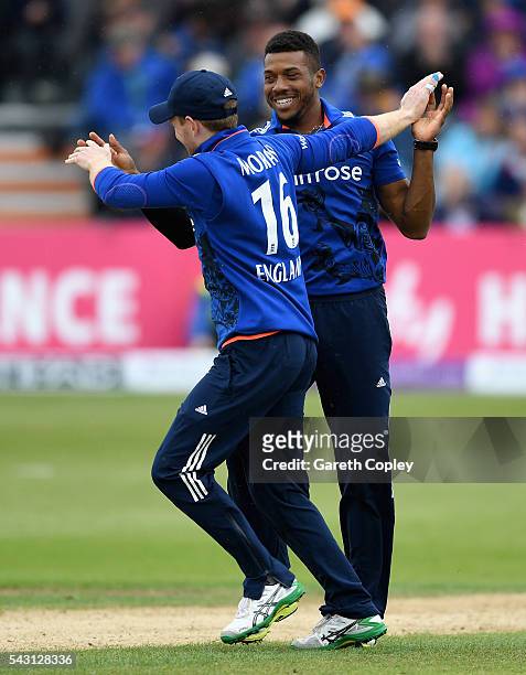 Chris Jordan of England celebrates with captain Eoin Morgan after dismissing Angelo Mathews of Sri Lanka during the 3rd ODI Royal London One Day...