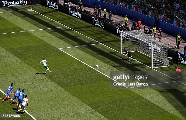 Robbie Brady of Republic of Ireland converts the penalty to score the opening goal past Hugo Lloris of France during the UEFA EURO 2016 round of 16...