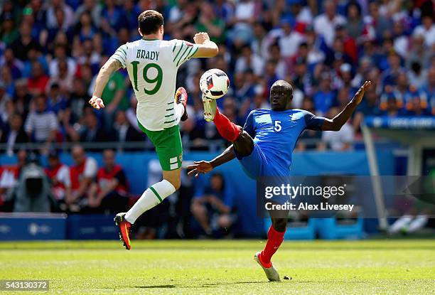 Golo Kante of France and Robbie Brady of Republic of Ireland compete for the ball during the UEFA EURO 2016 round of 16 match between France and...