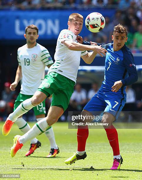 James McCarthy of Republic of Ireland and Antoine Griezmann of France compete for the ball during the UEFA EURO 2016 round of 16 match between France...