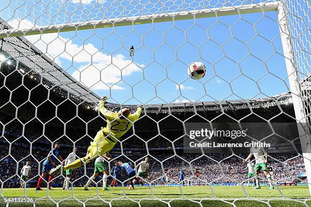 Darren Randolph of Republic of Ireland dives in vain as Antoine Griezmann of France scores his team's second goal during the UEFA EURO 2016 round of...