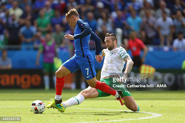 Shane Duffy of Republic of Ireland tackles Antoine Griezmann of France and is subsequently sent off during the UEFA EURO 2016 Round of 16 match...