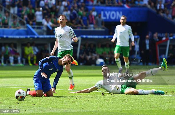 Shane Duffy of Republic of Ireland fouls Antoine Griezmann of France resulting in a red card during the UEFA EURO 2016 round of 16 match between...