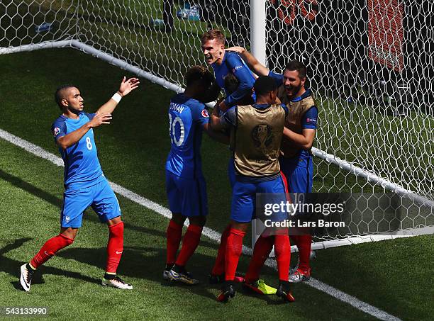 Antoine Griezmann of France celebrates scoring his team's second goal with his team mates during the UEFA EURO 2016 round of 16 match between France...