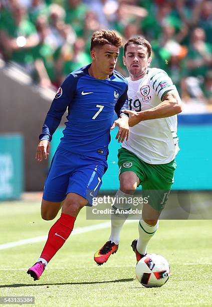 Antoine Griezmann of France vies with Robbie Brady of Ireland during the UEFA Euro 2016 Round of 16 football match between France and Ireland at the...