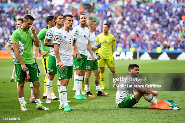 Dejected Republic of Ireland players including Seamus Coleman and Shane Long are seen in front of their supporters after their team's 1-2 defeat in...