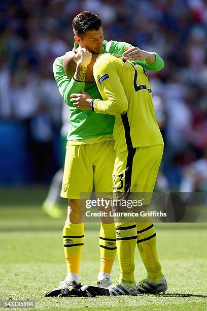 Darren Randolph of Republic of Ireland is consoled by Keiren Westwood after their team's 1-2 defeat in the UEFA EURO 2016 round of 16 match between...