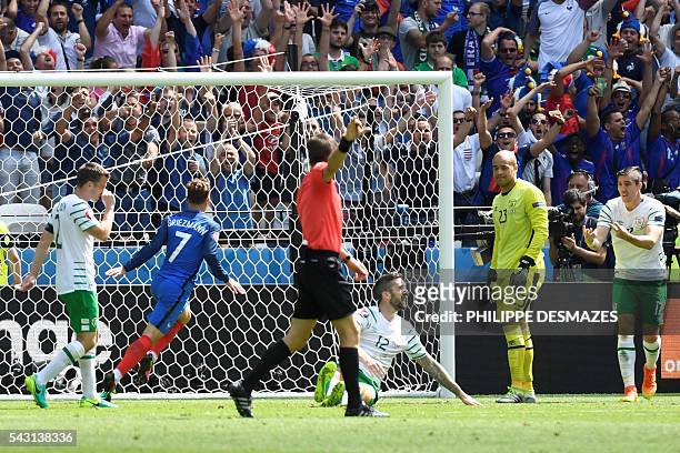 France's forward Antoine Griezmann scores a goal during the Euro 2016 round of 16 football match between France and Republic of Ireland at the Parc...