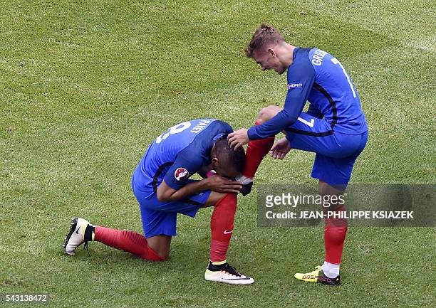 France's forward Antoine Griezmann celebrates scoring a second goal with France's forward Dimitri Payet during the Euro 2016 round of 16 football...
