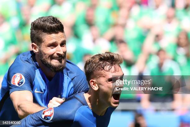 France's forward Antoine Griezmann celebrates scoring a goal next to France's forward Olivier Giroud during the Euro 2016 round of 16 football match...
