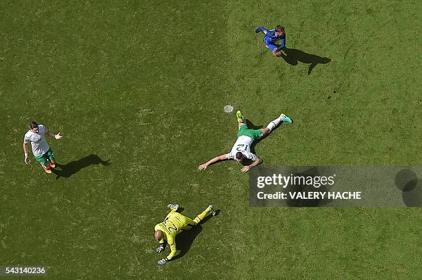 France's forward Antoine Griezmann celebrates after scoring against Ireland's goalkeeper Darren Randolph during the Euro 2016 round of 16 football...