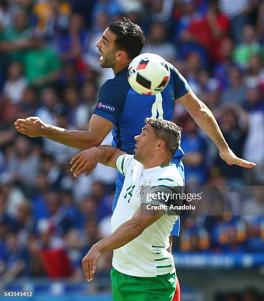 Adil Rami of France vies with Jon Walters during the UEFA Euro 2016 Round of 16 football match between France and Ireland at the Stade de Lyon in...