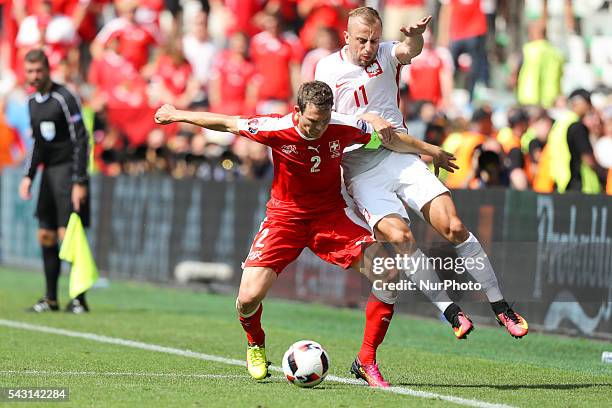 Stephan Lichtsteiner , Kamil Grosicki , during the UEFA EURO 2016 round of 16 match between Switzerland and Poland at Stade Geoffroy-Guichard on June...