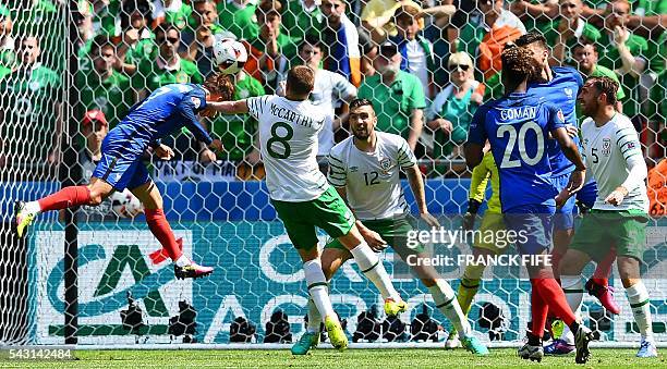 France's forward Antoine Griezmann heads the ball to score during the Euro 2016 round of 16 football match between France and Republic of Ireland at...