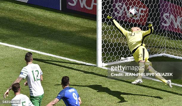 France's forward Antoine Griezmann heads the ball to score a goal past Ireland's goalkeeper Darren Randolph during the Euro 2016 round of 16 football...
