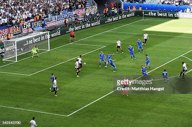 Jerome Boateng of Germany scores the opening goal during the UEFA EURO 2016 round of 16 match between Germany and Slovakia at Stade Pierre-Mauroy on...