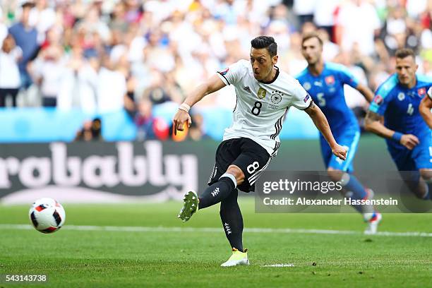 Mesut Oezil of Germany takes a penalty saved by Matus Kozacik of Slovakia during the UEFA EURO 2016 round of 16 match between Germany and Slovakia at...