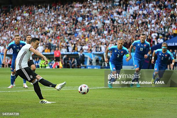 Mesut Ozil of Germany takes and misses a penalty kick during the UEFA Euro 2016 Round of 16 match between Germany and Slovakia at Stade Pierre-Mauroy...