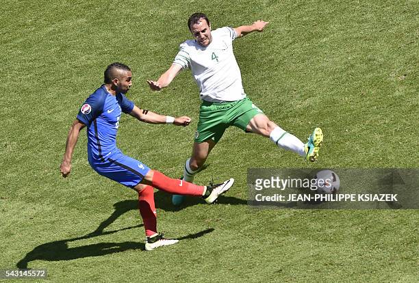 France's forward Dimitri Payet and Ireland's defender John O'Shea vie for the ball during the Euro 2016 round of 16 football match between France and...
